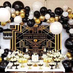 a birthday party with black and white balloons, gold foil decorations, and an art deco theme