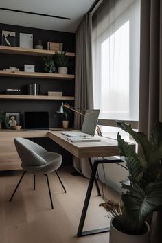 a desk with a laptop on it next to a plant and bookshelf in a room