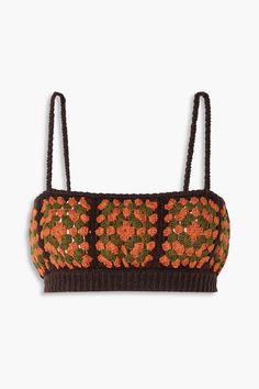 an orange and brown knitted top with flowers on it