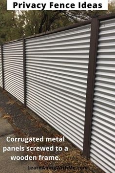 a metal fence with the words privacy fence ideas corrgated metal panels screwed to a wooden frame