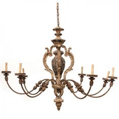 an ornate chandelier with five candles hanging from it