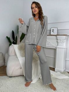 Elevate relaxation with our 2-piece Contrast Binding Casual Lounge Set. Effortless style meets comfort in this knitted polyester ensemble. Express yourself in a plain pattern with pocket and button front details. Loose fit & medium stretch ensure all-day ease. Long sleeves for extra coziness. Easy care with machine wash or dry clean. Unwind fashionably. Features: Style: Casual-Comfy Pattern Type: Plain Type: Pant Sets Details: Pocket, Contrast Binding, Button Front Sleeve Length: Long Sleeve Fit Gray Loungewear Sets With Pockets, Casual Loungewear Sets With Button Closure, Long Sleeve Loungewear Sets With Button Closure, Casual Gray Sets With Pockets, Casual Daywear Sets With Pockets, Fall Loungewear Sets With Button-up, Fall Loungewear Button-up Sets, Relaxed Fit Button-up Loungewear Sets, Button-up Sleepwear With Pockets For Loungewear