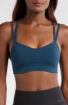 Signature Dri-FIT tech keeps you dry and comfortable in this strappy sports bra with a foam pad insert for extra coverage. Elasticized straps Dri-FIT moisture-wicking technology Lined 63% nylon, 37% spandex Machine wash, line dry Imported Compressive Strappy Activewear, Compressive Strappy Activewear With Straps, Supportive Strapped Sporty Activewear, Supportive Strappy Sporty Activewear, Strappy Moisture-wicking Sports Bra, Moisture-wicking Strappy Sports Bra, Sporty Breathable Strappy Sports Bra, Sporty Strappy Breathable Sports Bra, Strappy Moisture-wicking Sports Bra For Pilates