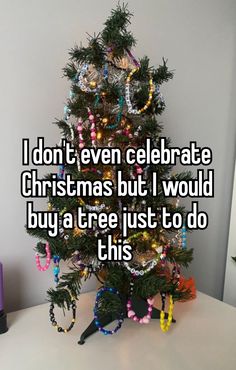 a christmas tree with lights on it that says i don't even celebrate christmas but i would buy a tree just to do this