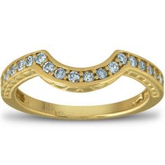 a yellow gold wedding band with white diamonds