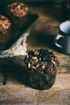 some muffins sitting on top of a wooden table