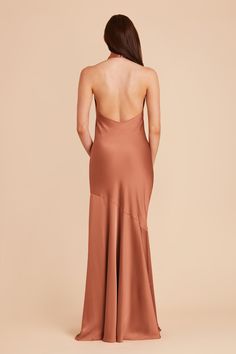 the back of a woman in a brown dress