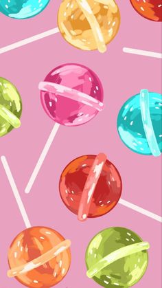 colorful lollipops on a pink background with white lines in the bottom corner