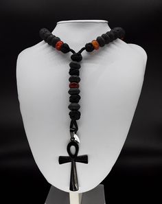 The Ankh Paracord Rosary is a unique 5 Decade Catholic Rosary that is based on the foundation of of Volcanic Lava stone that is directly extracted from Mt Vesuvius (all stones have been purified and cleansed). On top of that, it is supported by Carnelian beads and a black stainless steel Ankh Cross symbolizing the eternal life. Moreover, the rosary has been officially blessed by the church. If you are looking for a rosary that differentiates itself from the rest, the Ankh Paracord Rosary is the Adjustable Black Beaded Necklaces With Natural Stones, Black Adjustable Artisan Necklace, Black Handmade Beaded Necklace For Healing, Handmade Black Beaded Necklaces For Healing, Handmade Black Onyx Beads, Black Handmade Beaded Necklaces For Healing, Artisan Black Onyx Necklace, Handmade Spiritual Black Necklace, Artisan Black Beaded Necklaces With Adjustable Fit