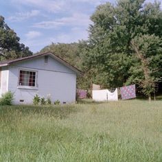 an old house with clothes hanging out to dry