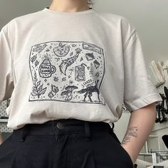 some items are shipped separately - shipping cost is not effected and they should arrive on the same day/week : t-shirts (shipped from studio 1) sweaters and hoodies (shipped from studio 2) prints, notebooks, stickers, hats, bookmarks, mugs (shipped from home). 𓋼 my original lino cut print 𓋼 model is size uk 10 shown wearing size Xlarge 𓋼 orders are normally shipped out 2-7 days after purchase however, can take up to 14 days in some circumstances. 𓋼 message me for more size options, colour options or a custom design. 𓋼 return policy: no returns unless the item is damaged, this is due to being made to order and custom. 𓋼  cancellation: up 3 hours after order.  𓋼 i hope you all have a magical day and thank you for visiting my lil side on Etsy :) top information * 100% combed and ring- Witchy Outfits, Have A Magical Day, Custom Tee Shirts, Vibe Clothes, Linocut, Cute Shirts