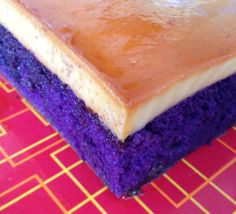 a piece of cake with purple and yellow frosting