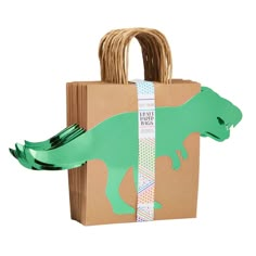 a paper bag with an image of a dinosaur on it