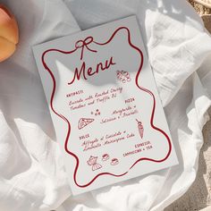 a white menu card sitting on top of a table