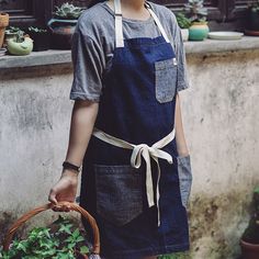 a woman holding a basket full of vegetables