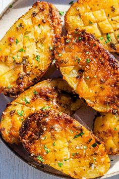 grilled potatoes on a plate with parsley