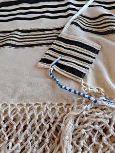 "A Jewish woven prayer shawl. Jewish man's prayer shawl (tallit in Hebrew) is made of cotton. This tallit is a traditional Yemenite tallit that has a combination of black, gold, and white. The tallit is handwoven from fine cotton on traditional looms by Jewish men in Israel. The tzitzit are tied by the Yemenite tradition. You can add a matching tallit bag: https//www.etsy.com/listing/849486860/ You can add matching kippah// yarmulke: https://www.etsy.com/listing/867562773/ Purchase this elegant Jewish Fashion, Hebrew Blessing, Jewish Prayer, High Holidays, Jewish Men, Judaica Art, Prayer Shawl, Sewing Workshop, Jewish Jewelry