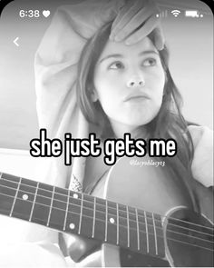 a girl holding a guitar with the caption she just gets me