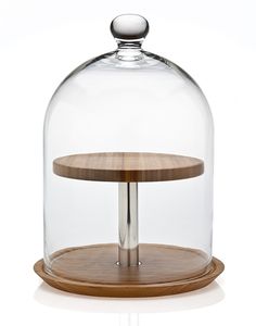 a glass clochet with a wooden stand underneath it