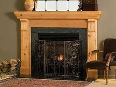 a living room with a fire place and chair next to the fireplace in front of it