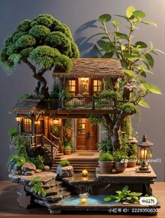 a doll house with trees and plants on the roof is displayed in front of a pond