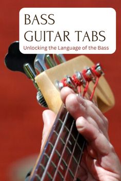 a person holding an acoustic guitar with the title bass guitar tabs unlocking the language of the bass