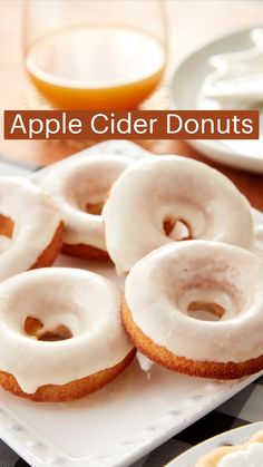 apple cider donuts with icing on a white plate