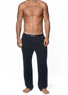 Ultra-comfort meets classic style in our premium stretch modal lounge pants with a sleek tailored fit. Features deep side pockets, faux fly detail, and dyed-to-match, no-roll, signature logo elastic waistband that stays in place, ensuring a comfortable fit throughout the day. Fabricated from a high quality, irresistibly soft, double-face Lenzing modal elastane fabric, providing butter-like softness and superior breathability with lots of stretch for unparalleled comfort and flexibility 88% Lenzi Classic Full-length Loungewear Pants, Classic Full Length Loungewear Pants, Navy Loungewear Pants, Elastane Fabric, Stretch Shorts, Short Shirts, Knit Shorts, Double Face, Lounge Pants