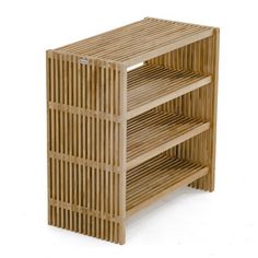 a wooden shelf sitting on top of a white floor