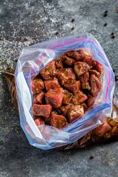 a bag filled with meat sitting on top of a table