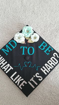 a decorated graduation cap that says, mad to be what life is it's