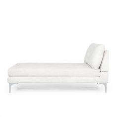 a white chaise lounger with pillows on it