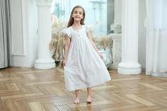 Keep your little one cool and comfortable on summer nights with our "Belle" Nightdress. Made of soft white cotton and featuring delicate broderie detailing. This nightdress is perfect for warmer weather. The short flutter sleeves add a touch of sweetness to this essential piece for any little girl's sleepwear collection. Item Type: Nightdress Material: Cotton Broderie Fit: Fits true to size, take your normal size Length: Mid-Calf Age Range: 3 Years-12 Years Girls Sleepwear, Summer Nights, Flutter Sleeve, Night Dress, Mid Calf, White Cotton, Boutique, Art