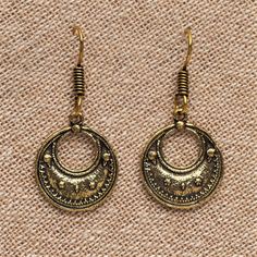 These crescent moon drop earrings feature an eye-catching design with an added beaded detailing. Great for everyday wear! ⚬ Drop 4cm ⚬ Hook Closure ⚬ Weight 3g (each) ⚬ Recycled Pure Brass ⚬ Nickel Free and Hypoallergenic ⚬ Handcrafted by Artisans in Pushkar, India ⚬ Sold as a Pair ♡ Treat yourself or gift that special someone. Each pair comes perfectly packaged in a charming OMishka branded pouch. Have a question? Please message me ♡ Crescent Shaped Festival Earrings, Vintage Crescent Moon Charm Earrings, Metal Hoop Earrings With Moon Charm, Round Metal Hoop Earrings With Moon Charm, Vintage Crescent Nickel-free Earrings, Elegant Crescent Earrings For Festival, Elegant Crescent Shaped Festival Earrings, Metal Crescent Earrings For Festival, Crescent Metal Earrings For Festivals