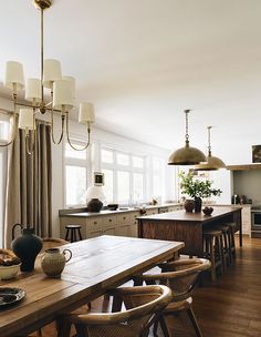 a dining room table and chairs in a kitchen