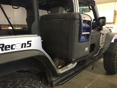 the back end of a jeep with its cargo bag on it