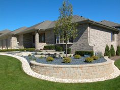 a house with landscaping in front of it