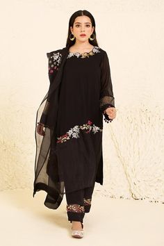 Black georgette kurta with gold and silver handwork, sequins, and thread hand embroidery. Comes with pant and a soft net dupatta.
Components: 3
Pattern: Hand Embroidered
Type Of Work: Sequin, Thread Hand Work
Neckline: Round
Sleeve Type: Full
Fabric: Georgette, Crepe and organza
Color: Black
Other Details: 
Semi-sheer sleeve hem and pant hem
Tassel edged sleeve
Floral patterns
Occasion: Reception - Aza Fashions Georgette Kurta, Kurta Set For Women, How To Hem Pants, Net Dupatta, Hand Work, Kurta Set, Sheer Sleeves, Floral Patterns, Set For Women