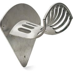 a metal utensil holder shaped like a heart