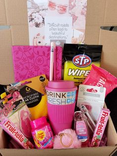 a pink box filled with lots of different items