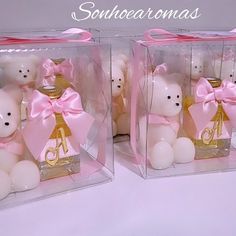 two clear boxes with teddy bears in pink bows and gold letters on the front one has a crown