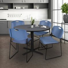 a table with four chairs around it in a kitchen