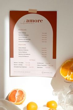 an orange is sitting on a table next to a menu