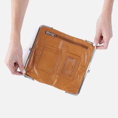 Owned and loved by over 1.5 million women, the Lauren clutch-wallet is the accessory you can't live without. Wallet by day. Clutch by night. Lauren securely holds your phone, cash, cards, ID and more. Hair Clothes, Natural Brown, Clutch Wallet, Frame Design, Leather Handbags, Wallet, Leather, Color