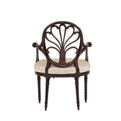 an antique chair with white upholstered seat and armrests, on a white background