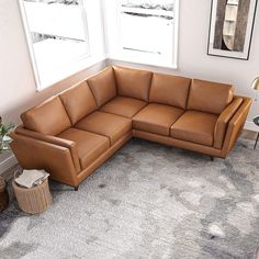 a living room with a large sectional couch