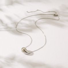 Durable and stylish, our waterproof necklace crafted for both functionality and fashion. Perfect for any occasion, it's the ideal accessory for those who appreciate durability and timeless elegance. Perfect for the minimalist and a beautiful piece to layer with. A true versatile statement piece that you can wear straight from the pool to dinner! - 18K gold plated / stainless steel - Waterproof technology - Hypoallergenic Chic Teardrop Necklace For Gift, Chic Long Drop Necklaces For Gifts, Elegant Charm Necklace With Delicate Stainless Steel Chain, Elegant Hypoallergenic Round Pendant Necklace, Elegant Hypoallergenic White Gold Charm Necklaces, Elegant Stainless Steel Charm Necklace With Delicate Chain, Modern Silver Hypoallergenic Necklace, Modern Hypoallergenic Silver Necklace, Elegant Stainless Steel Necklace