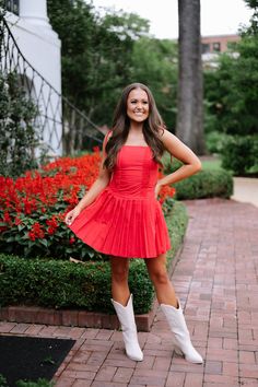 This bold and vibrant red mini dress features playful shoulder tie spaghetti straps and a flattering square neckline. The zipper closure back allows for easy dressing, while the drop waist and pleated skirt add a touch of fun and movement. Perfect for a night out or special occasion. 80% polyester, 20% cotton Fully lined Model is 5'5" and a size 2 - wearing a small Size rec: 0-2 S, 4-6 M, 8 L Summer Pleated Mini Dress With Square Neck, Summer Square Neck Pleated Mini Dress, Summer Mini Dress With Square Neck And Pleats, Flirty Red Mini Dress With Adjustable Straps, Flirty Red Dress With Adjustable Straps, Chic Red Mini Dress With Adjustable Straps, Red Mini Dress With Adjustable Straps, Spring Red Mini Dress With Adjustable Straps, Red Mini Dress With Adjustable Straps For Spring