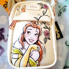 Super Cool Disney Belle Beauty And The Beast Crossbody Bag. It Has A Large Zipper Compartment And A Smaller Zipper Compartment On The Front With An Adjustable Strap. Great For Travel Or Everyday Use. Made Out Of A Soft Leather Material. Beauty And The Beast Purse, Disney Crossbody Bag, Disney Style Shoulder Bag With Removable Pouch, Disney White Bags For Disney Trips, Disney White Travel Shoulder Bag, Disney Style White Shoulder Travel Bag, Crossbody Shoulder Bag For Disney Trips, Beauty And The Beast Inspired Outfits, Crystal Round Chandelier