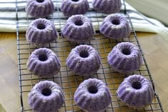 purple donuts on a cooling rack ready to be baked into bundts or cupcakes